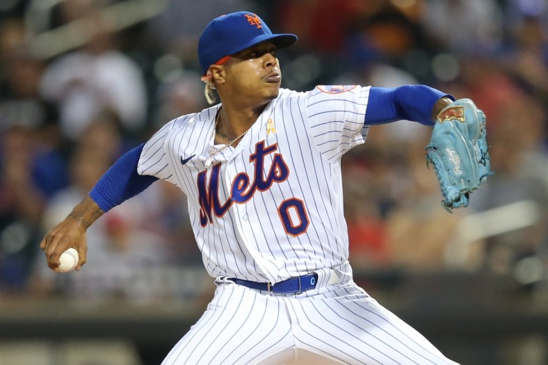 Sep 14, 2021; New York City, New York, USA; New York Mets starting pitcher Marcus Stroman (0) delivers against the St. Louis Cardinals during the first inning at Citi Field. Mandatory Credit: Brad Penner-USA TODAY Sports