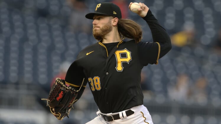 Sep 14, 2021; Pittsburgh, Pennsylvania, USA; Pittsburgh Pirates starting pitcher Dillon Peters (38) delivers against the Cincinnati Reds during the first inning at PNC Park. Mandatory Credit: Charles LeClaire-USA TODAY Sports