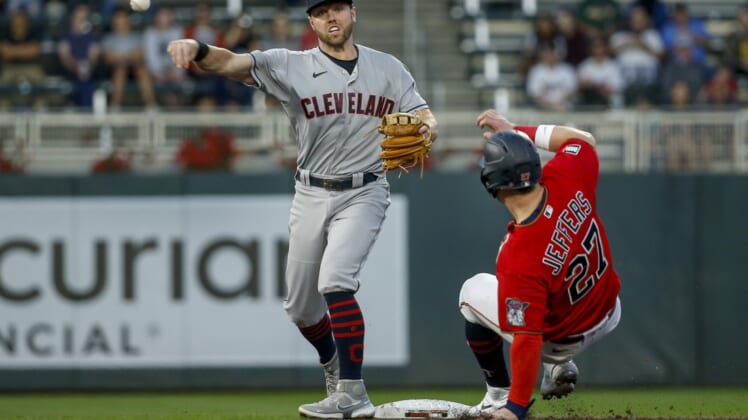 Sep 14, 2021; Minneapolis, Minnesota, USA; Cleveland Indians second baseman Owen Miller (6) forces out Minnesota Twins catcher Ryan Jeffers (27) and turns a double play in the second inning at Target Field. Mandatory Credit: Bruce Kluckhohn-USA TODAY Sports