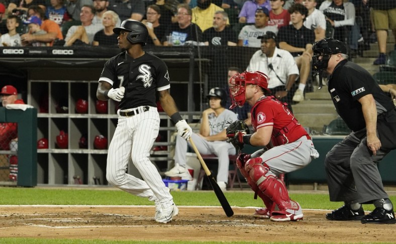 Sep 14, 2021; Chicago, Illinois, USA; Chicago White Sox shortstop Tim Anderson (7) hits a single against the Los Angeles Angels during the second inning at Guaranteed Rate Field. Mandatory Credit: David Banks-USA TODAY Sports