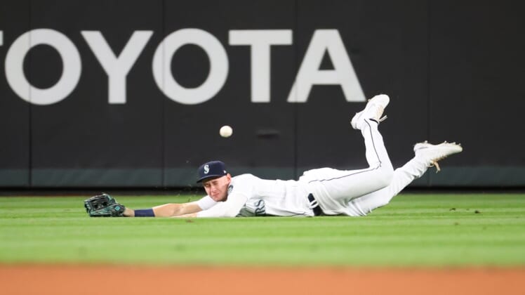 Sep 14, 2021; Seattle, Washington, USA;  Seattle Mariners center fielder Jarred Kelenic (10) is unable to make the catch for a hit off the bat of Boston Red Sox shortstop Jose Iglesias (12) in the fifth inning at T-Mobile Park. Mandatory Credit: Abbie Parr-USA TODAY Sports