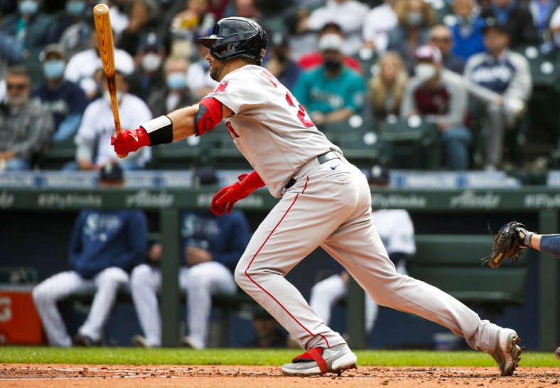 Sep 15, 2021; Seattle, Washington, USA; Boston Red Sox catcher Kevin Plawecki (25) hits an RBI-fielders choice against the Seattle Mariners during the second inning at T-Mobile Park. Mandatory Credit: Joe Nicholson-USA TODAY Sports