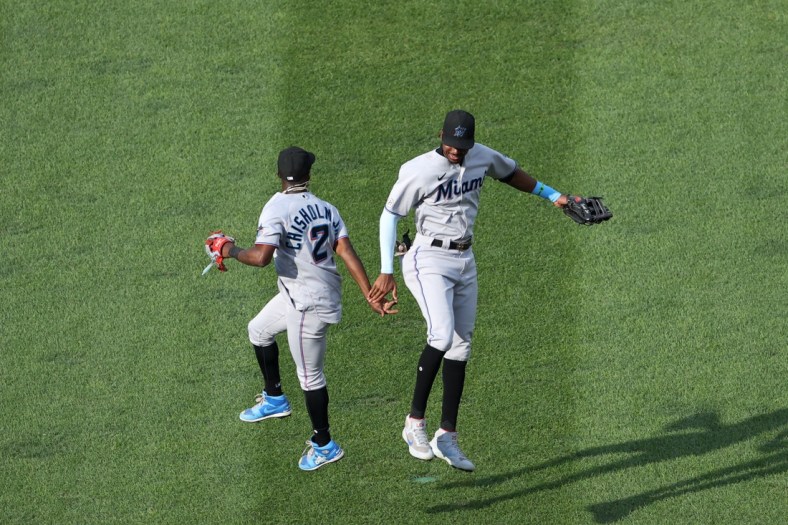 Sep 15, 2021; Washington, District of Columbia, USA; Miami Marlins second baseman Jazz Chisholm Jr. (2) celebrates with Marlins right fielder Lewis Brinson (25) after their game against the Washington Nationals at Nationals Park. Mandatory Credit: Geoff Burke-USA TODAY Sports