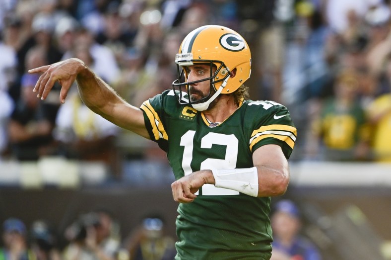 Sep 12, 2021; Jacksonville, Florida, USA; Green Bay Packers quarterback Aaron Rodgers (12) throws against the New Orleans Saints during the first half  at TIAA Bank Field. Mandatory Credit: Tommy Gilligan-USA TODAY Sports