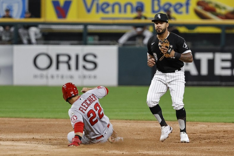 Sep 15, 2021; Chicago, Illinois, USA; Los Angeles Angels third baseman David Fletcher (22) steals second base against Chicago White Sox left fielder Leury Garcia (28) during the third inning at Guaranteed Rate Field. Mandatory Credit: Kamil Krzaczynski-USA TODAY Sports