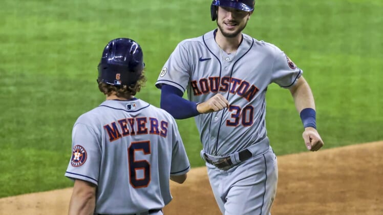 Sep 15, 2021; Arlington, Texas, USA;  Houston Astros right fielder Kyle Tucker (30) celebrates with center fielder Jake Meyers (6) after hitting a home run during the eighth inning against the Texas Rangers at Globe Life Field. Mandatory Credit: Kevin Jairaj-USA TODAY Sports