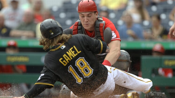 Sep 16, 2021; Pittsburgh, Pennsylvania, USA;  Cincinnati Reds catcher Tyler Stephenson (37) tags Pittsburgh Pirates left fielder Ben Gamel (18) out at home plate attempting to score during the second inning at PNC Park. Mandatory Credit: Charles LeClaire-USA TODAY Sports