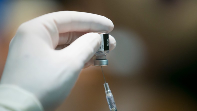 Pharmacist Tim Sage assembles a dose of the Pfizer-BioNTech COVID-19 vaccine at SwedishAmerican hospital on Thursday, Dec. 17, 2020, in Rockford.COVID-19 Vaccine