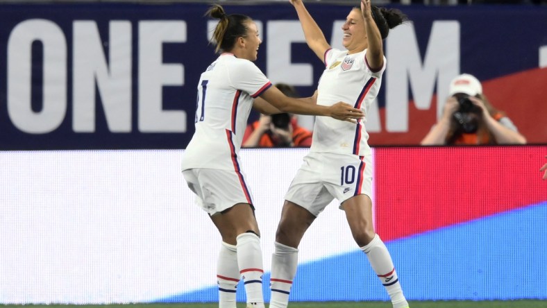 Sep 16, 2021; Cleveland, Ohio, USA; USA forward Carli Lloyd (10) celebrates with forward Mallory Pugh (11) after scoring her first goal against Paraguay in the first half of an international friendly soccer match at FirstEnergy Stadium. Mandatory Credit: David Richard-USA TODAY Sports