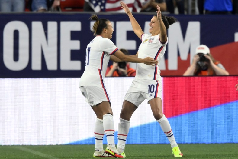 Sep 16, 2021; Cleveland, Ohio, USA; USA forward Carli Lloyd (10) celebrates with forward Mallory Pugh (11) after scoring her first goal against Paraguay in the first half of an international friendly soccer match at FirstEnergy Stadium. Mandatory Credit: David Richard-USA TODAY Sports