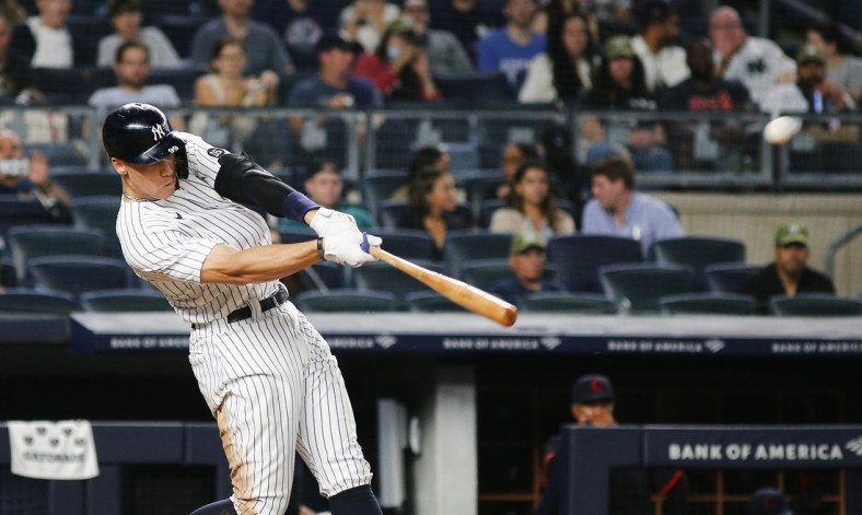 Sep 17, 2021; Bronx, New York, USA; New York Yankees right fielder Aaron Judge (99) hits a solo home run against the Cleveland Indians during the fourth inning at Yankee Stadium. Mandatory Credit: Andy Marlin-USA TODAY Sports