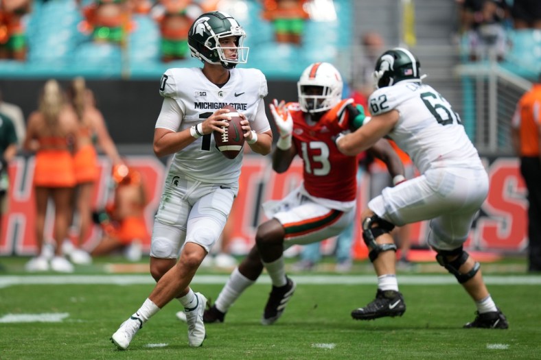 Sep 18, 2021; Miami Gardens, Florida, USA; Michigan State Spartans quarterback Payton Thorne (10) drops back before attempting a pass during the first half against the Miami Hurricanes at Hard Rock Stadium. Mandatory Credit: Jasen Vinlove-USA TODAY Sports