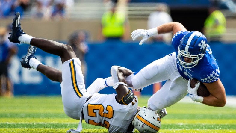 Sep 18, 2021; Lexington, Kentucky, USA; Kentucky Wildcats tight end Brenden Bates (80) is tackled by Chattanooga Mocs defensive back Jerrell Lawson (27) during the second quarter at Kroger Field. Mandatory Credit: Jordan Prather-USA TODAY Sports