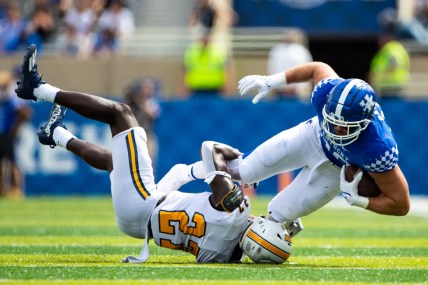Sep 18, 2021; Lexington, Kentucky, USA; Kentucky Wildcats tight end Brenden Bates (80) is tackled by Chattanooga Mocs defensive back Jerrell Lawson (27) during the second quarter at Kroger Field. Mandatory Credit: Jordan Prather-USA TODAY Sports