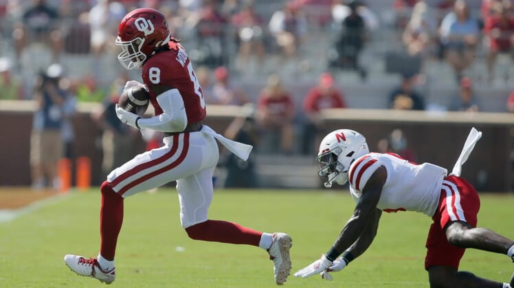 Oklahoma's Michael Woods II (8) catches the ball in front of of Nebraska's Cam Taylor-Britt (5) during a college football game between the University of Oklahoma Sooners (OU) and the Nebraska Cornhuskers at Gaylord Family-Oklahoma Memorial Stadium in Norman, Okla., Saturday, Sept. 18, 2021.

Lx14541