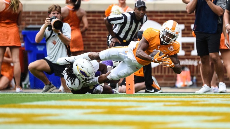 Sep 18, 2021; Knoxville, Tennessee, USA; Tennessee Volunteers wide receiver Velus Jones Jr. (1) dives over Tennessee Tech Golden Eagles defensive back Jamaal Boyd (8) for a touchdown during the first half at Neyland Stadium. Mandatory Credit: Bryan Lynn-USA TODAY Sports