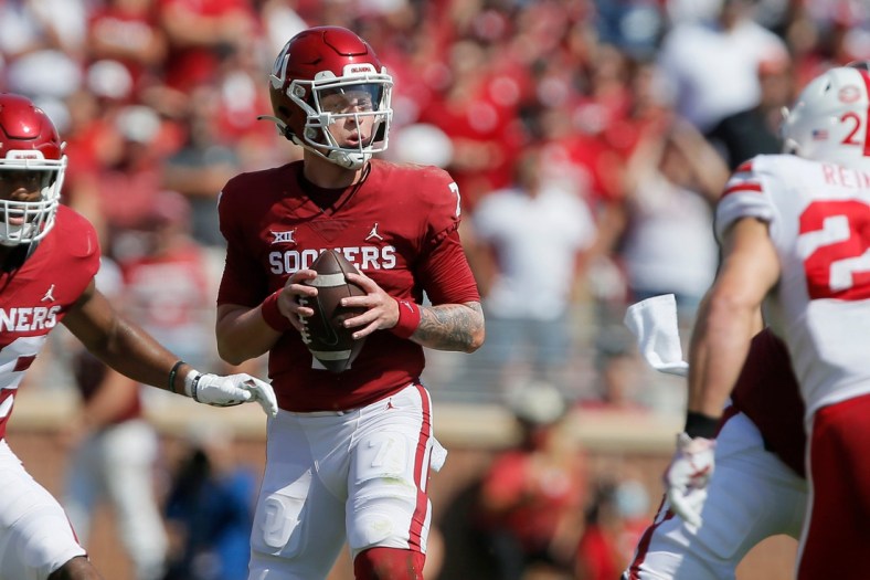 Oklahoma's Spencer Rattler (7) drops back to pass during a college football game between the University of Oklahoma Sooners (OU) and the Nebraska Cornhuskers at Gaylord Family-Oklahoma Memorial Stadium in Norman, Okla., Saturday, Sept. 18, 2021. Oklahoma won 23-16.

Lx15470
