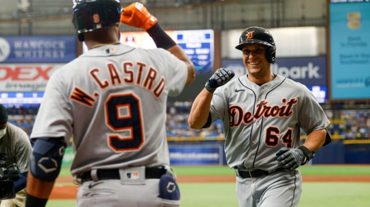 Sep 18, 2021; St. Petersburg, Florida, USA; Detroit Tigers catcher Dustin Garneau (64) is congratulated by shortstop Willi Castro (9) after hitting a home run in the second inning against the Tampa Bay Rays at Tropicana Field. Mandatory Credit: Nathan Ray Seebeck-USA TODAY Sports
