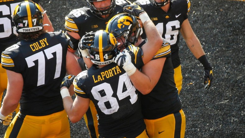 Members of the Iowa Hawkeyes football team celebrate after junior tight end Sam LaPorta scored a touchdown with seconds to go in the second quarter against Kent State at Kinnick Stadium in Iowa City on Saturday, Sept. 18, 2021.

20210918 Iowavskentstate