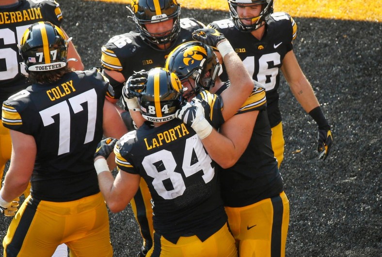Members of the Iowa Hawkeyes football team celebrate after junior tight end Sam LaPorta scored a touchdown with seconds to go in the second quarter against Kent State at Kinnick Stadium in Iowa City on Saturday, Sept. 18, 2021.

20210918 Iowavskentstate