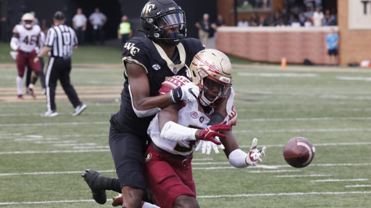 Sep 18, 2021; Winston-Salem, North Carolina, USA; Florida State Seminoles defensive back Jarvis Brownlee Jr. (3) is flagged for interference on Wake Forest Demon Deacons wide receiver Jaquarii Roberson (5) during the second quarter at Truist Field. Mandatory Credit: Reinhold Matay-USA TODAY Sports