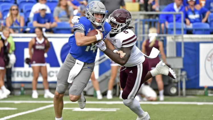 Sep 18, 2021; Memphis, Tennessee, USA; Memphis Tigers quarterback Seth Henigan (14) is pressured by Mississippi State Bulldogs defensive end Randy Charlton (5) during the first half at Liberty Bowl Memorial Stadium. Mandatory Credit: Justin Ford-USA TODAY Sports