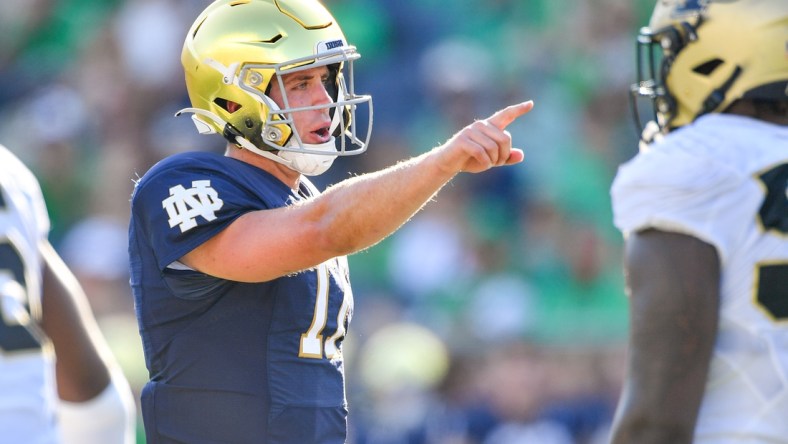 Sep 18, 2021; South Bend, Indiana, USA; Notre Dame Fighting Irish quarterback Jack Coan (17) signals in the fourth quarter against the Purdue Boilermakers at Notre Dame Stadium. Mandatory Credit: Matt Cashore-USA TODAY Sports