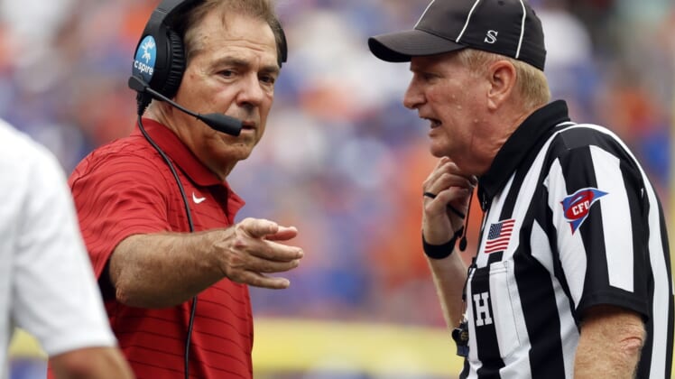 Sep 18, 2021; Gainesville, Florida, USA; Alabama Crimson Tide head coach Nick Saban talks to the referee against the Florida Gators during the second half at Ben Hill Griffin Stadium. Mandatory Credit: Kim Klement-USA TODAY Sports