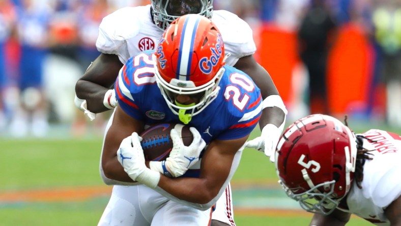 Florida Gators running back Malik Davis (20) runs the ball during the football game between the Florida Gators and The Alabama Crimson Tide, at Ben Hill Griffin Stadium in Gainesville, Fla. Sept. 18, 2021.

Flgai 09182021 Ufvs Bama 36