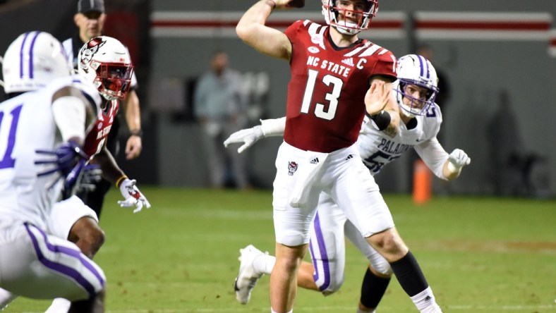 Sep 18, 2021; Raleigh, North Carolina, USA; North Carolina State Wolfpack quarterback Devin Leary (13) throws a pass during the first half against the Furman Paladins at Carter-Finley Stadium. Mandatory Credit: Rob Kinnan-USA TODAY Sports