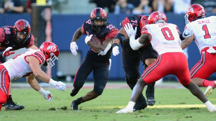 Sep 18, 2021; Carson, California, USA; San Diego State Aztecs running back Greg Bell (22) runs the ball against the Utah Utes during the first half at Dignity Health Sports Park. Mandatory Credit: Gary A. Vasquez-USA TODAY Sports