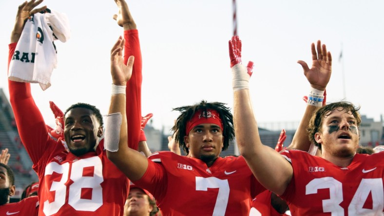 Ohio State Buckeyes defensive back Cameron Kittle (38), Ohio State Buckeyes quarterback C.J. Stroud (7) and Ohio State Buckeyes tight end Mitch Rossi (34) sing "Carmen Ohio" following Saturday's NCAA Division I football game against the Tulsa Golden Hurricanes at Ohio Stadium in Columbus on September 18, 2021. Ohio State won the game 41-20.

Osu21tlsa Bjp 1218