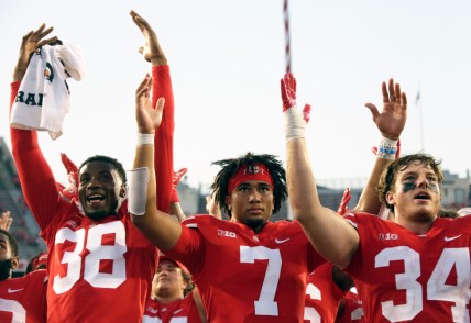 Ohio State Buckeyes defensive back Cameron Kittle (38), Ohio State Buckeyes quarterback C.J. Stroud (7) and Ohio State Buckeyes tight end Mitch Rossi (34) sing "Carmen Ohio" following Saturday's NCAA Division I football game against the Tulsa Golden Hurricanes at Ohio Stadium in Columbus on September 18, 2021. Ohio State won the game 41-20.

Osu21tlsa Bjp 1218