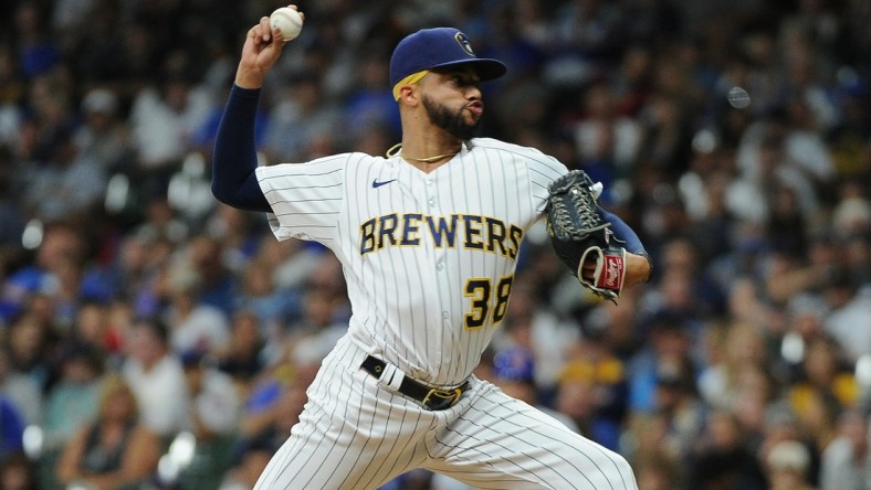 Sep 18, 2021; Milwaukee, Wisconsin, USA;  Milwaukee Brewers relief pitcher Devin Williams (38) delivers a pitch against the Chicago Cubs in the eighth inning at American Family Field. Mandatory Credit: Michael McLoone-USA TODAY Sports