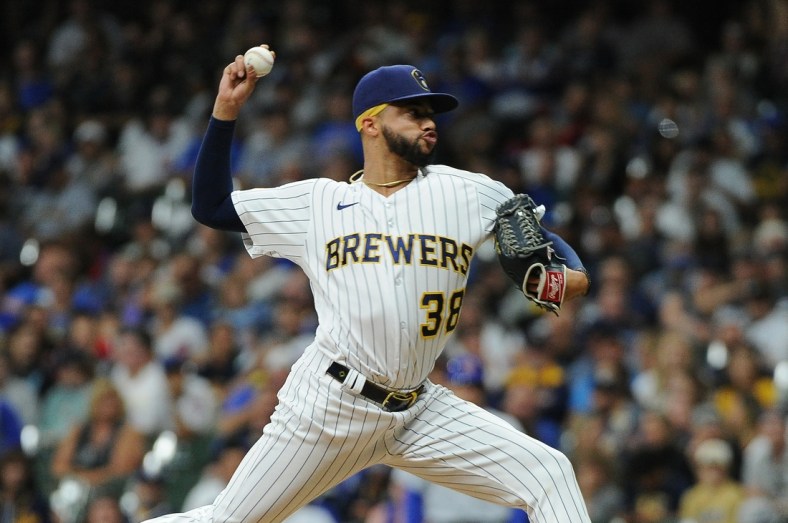 Sep 18, 2021; Milwaukee, Wisconsin, USA;  Milwaukee Brewers relief pitcher Devin Williams (38) delivers a pitch against the Chicago Cubs in the eighth inning at American Family Field. Mandatory Credit: Michael McLoone-USA TODAY Sports