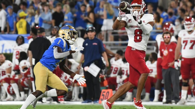 Sep 18, 2021; Pasadena, California, USA;  Fresno State Bulldogs wide receiver Ty Jones (8) makes a catch against UCLA Bruins defensive back Jay Shaw (1) in the second quarter at Rose Bowl. Mandatory Credit: Richard Mackson-USA TODAY Sports