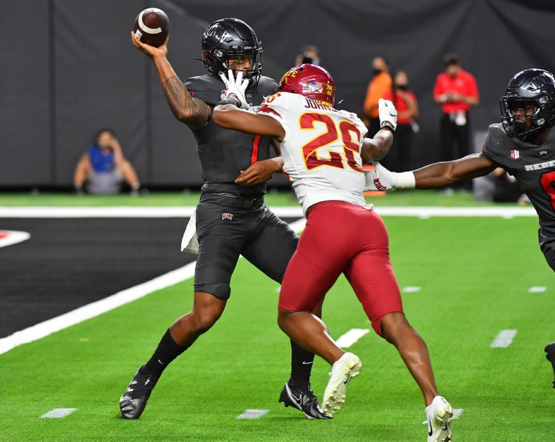 Sep 18, 2021; Paradise, Nevada, USA;  UNLV Rebels quarterback Cameron Friel (7) is pressured by Iowa State Cyclones defensive back Anthony Johnson Jr. (26) during the second quarter at Allegiant Stadium. Mandatory Credit: Stephen R. Sylvanie-USA TODAY Sports