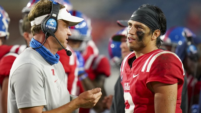 Sep 18, 2021; Oxford, Mississippi, USA; Mississippi Rebels quarterback Matt Corral (2) talks with Mississippi Rebels head coach Lane Kiffen at Vaught-Hemingway Stadium. Mandatory Credit: Marvin Gentry-USA TODAY Sports