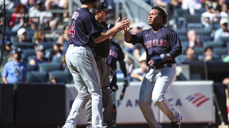 Sep 19, 2021; Bronx, New York, USA;  Cleveland Indians designated hitter Jose Ramirez (11) is greeted by center fielder Bradley Zimmer (4) after scoring in the third inning against the New York Yankees at Yankee Stadium. Mandatory Credit: Wendell Cruz-USA TODAY Sports