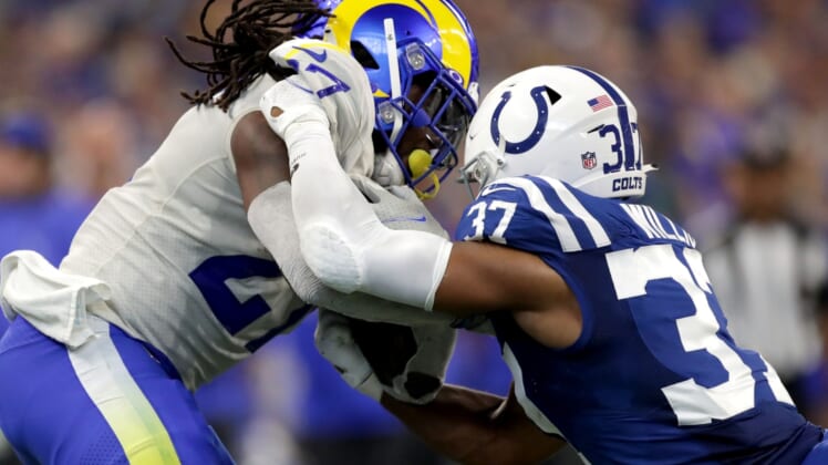 Indianapolis Colts safety Khari Willis (37) works to bring down Los Angeles Rams running back Darrell Henderson Jr. (27) on Sunday, Sept. 19, 2021, during a game against the Los Angeles Rams at Lucas Oil Stadium in Indianapolis.