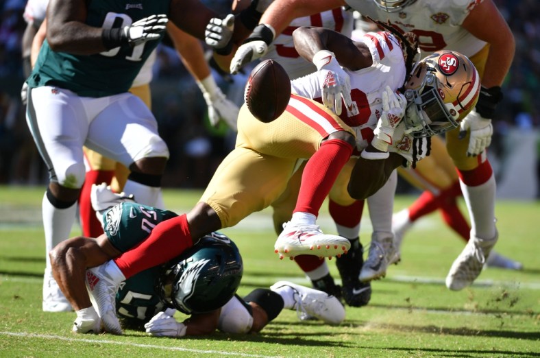 Sep 19, 2021; Philadelphia, Pennsylvania, USA;  San Francisco 49ers running back JaMycal Hasty (23) fumbles the football after being hit by Philadelphia Eagles linebacker Eric Wilson (50) during the fourth quarter at Lincoln Financial Field. Mandatory Credit: Eric Hartline-USA TODAY Sports