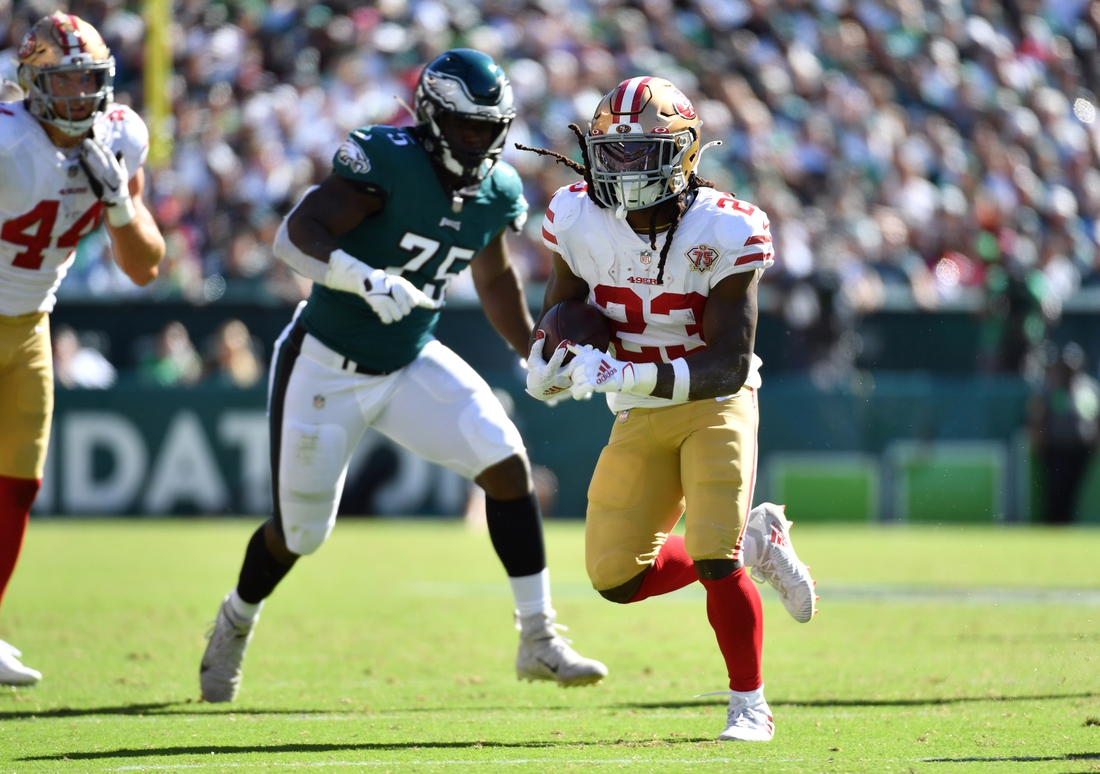 Sep 19, 2021; Philadelphia, Pennsylvania, USA; San Francisco 49ers running back JaMycal Hasty (23) runs past Philadelphia Eagles defensive end Tarron Jackson (75) during the fourth quarter at Lincoln Financial Field. Mandatory Credit: Eric Hartline-USA TODAY Sports