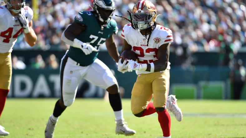 Sep 19, 2021; Philadelphia, Pennsylvania, USA; San Francisco 49ers running back JaMycal Hasty (23) runs past Philadelphia Eagles defensive end Tarron Jackson (75) during the fourth quarter at Lincoln Financial Field. Mandatory Credit: Eric Hartline-USA TODAY Sports