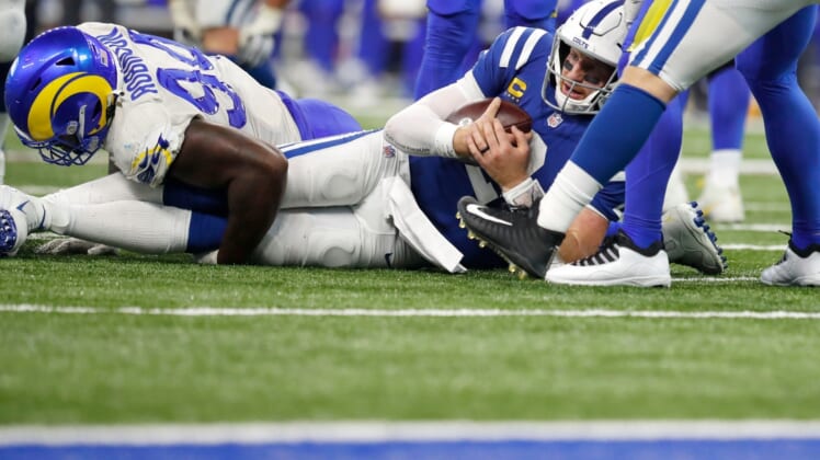 Indianapolis Colts quarterback Carson Wentz (2) is tackled close to the end zone during the second half of an Indianapolis Colts game against the Los Angeles Rams on Sunday, Sept. 19, 2021, at Lucas Oil Stadium. The Rams won 27-24.
