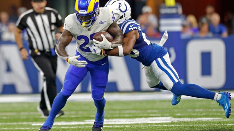Indianapolis Colts cornerback Kenny Moore II (23) tackles Los Angeles Rams running back Darrell Henderson Jr. (27) during the second half of an Indianapolis Colts game against the Los Angeles Rams on Sunday, Sept. 19, 2021, at Lucas Oil Stadium. The Rams won 27-24.
