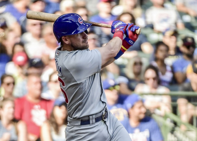 Sep 19, 2021; Milwaukee, Wisconsin, USA; Chicago Cubs third baseman Patrick Wisdom (16) hits a 3-run homer in the eighth inning against the Milwaukee Brewers  at American Family Field. Mandatory Credit: Benny Sieu-USA TODAY Sports