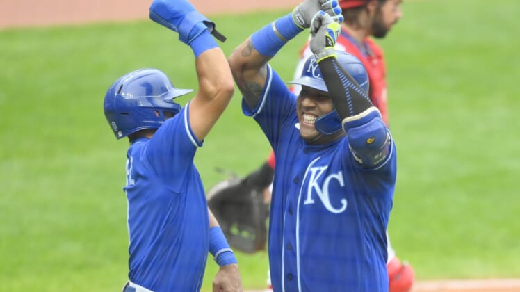 Sep 20, 2021; Cleveland, Ohio, USA; Kansas City Royals catcher Salvador Perez (13) celebrates his two-run home run with shortstop Nicky Lopez (8) in the fifth inning against the Cleveland Indians at Progressive Field. Mandatory Credit: David Richard-USA TODAY Sports
