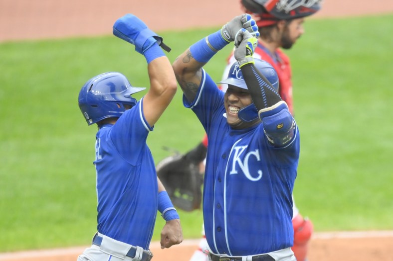 Sep 20, 2021; Cleveland, Ohio, USA; Kansas City Royals catcher Salvador Perez (13) celebrates his two-run home run with shortstop Nicky Lopez (8) in the fifth inning against the Cleveland Indians at Progressive Field. Mandatory Credit: David Richard-USA TODAY Sports