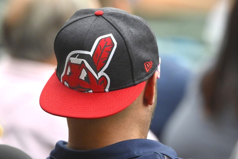 Sep 20, 2021; Cleveland, Ohio, USA; A fans wears a cap featuring the logo of Chief Wahoo during a game between the Cleveland Indians and the Kansas City Royals at Progressive Field. Mandatory Credit: David Richard-USA TODAY Sports