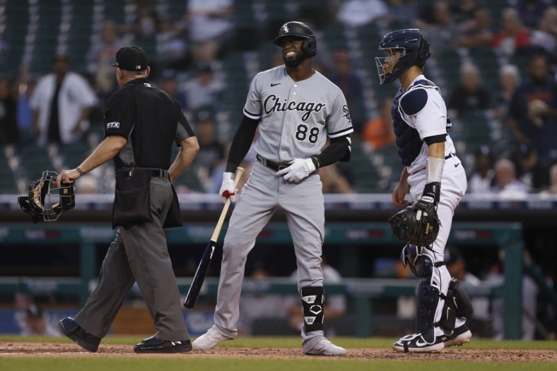 Sep 20, 2021; Detroit, Michigan, USA; Chicago White Sox center fielder Luis Robert (88) reacts after being hit by a pitch from Detroit Tigers starting pitcher Matt Manning (not pictured) during the third inning at Comerica Park. Mandatory Credit: Raj Mehta-USA TODAY Sports